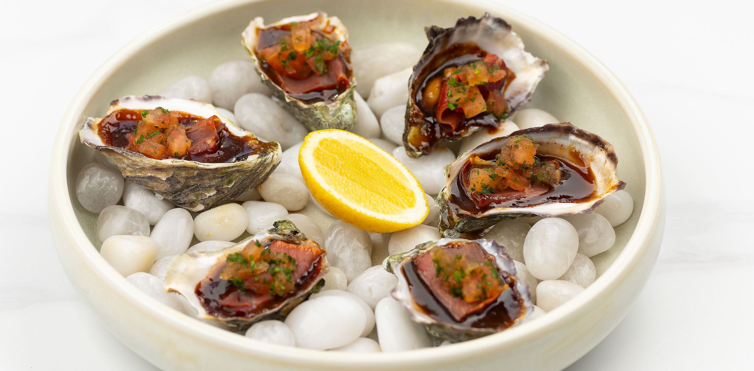 Image of of oysters with a lemon in the middle